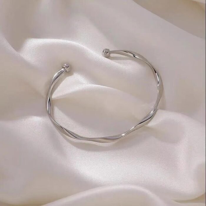 A Sleek And Stylish Twisted Texture Golden Bangle - Image 8