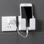1Pc Wall Mounted Phone Holder, Adhesive Pc Material, No Hole, Remote Control Storage, Made Of Other Plastic, With Smart Phone Charging Station, For Bathroom, Kitchen, Hotel Bedhead