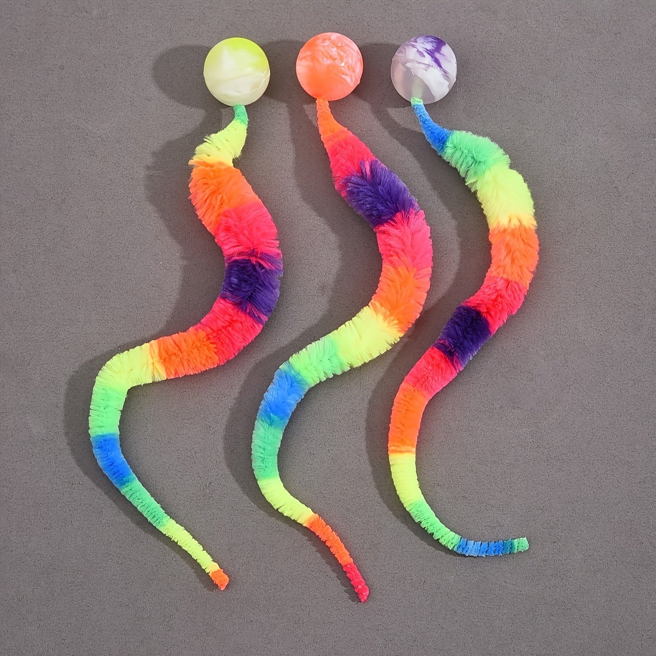 product-fancy-91908541-851b-4a62-a758-b014f09ed974.jpg 1Pc Cat Teaser Toy, Elastic For Caterpillar Bouncing Ball With Rainbow Worm For Pet Play - Image 1