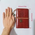 A Vintage Leather Notebook With A Matte Finish - Features An Antique Pirate-Themed Maritime Compass Design, Hardbound Writing Journal With A Metal Clasp And Spiral Binding. - Image 2