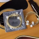 1 Set 6Pcs Practice Nickel Plated Steel Guitar Strings For Acoustic Guitars - Golden Coated Roundwound Strings With Polished Finish, Durable & Smooth Playability, Enhanced Tone & Control For Beginners & Advanced Players, Guitar Accessories, Acoustic Guitar Upgrade, Sleek String Design, Nickelplated Strings, Durable String Construction, Studio Practice, Roundwound Strings, Highquality Strings, Acoustic Guitarists - Image 2